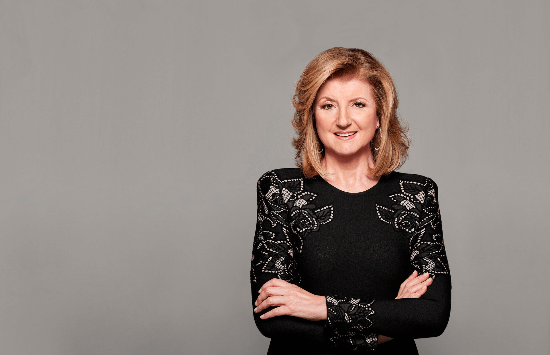 Arianna Huffington, founder of The Huffington Post, smiling in a professional portrait.