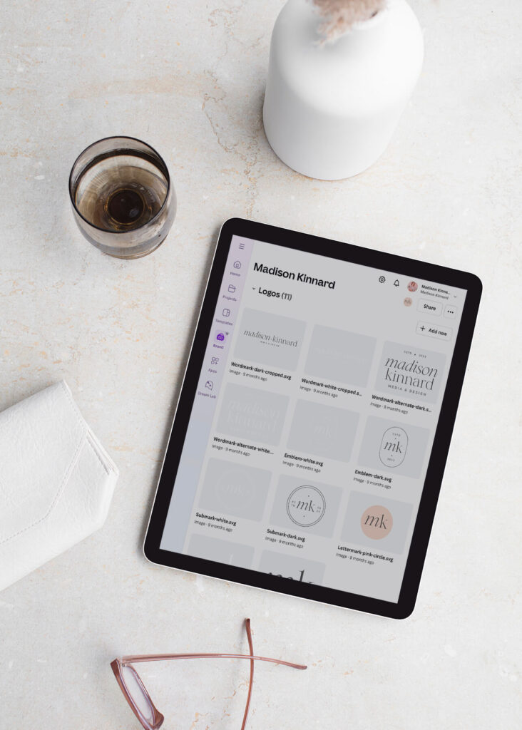 A minimalist flat lay featuring brand logos on an iPad—reflecting Madison Kinnard Media & Design’s calm, refined aesthetic.