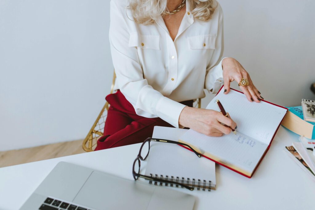 A woman entrepreneur reviewing her digital tools during a tech audit for her business.