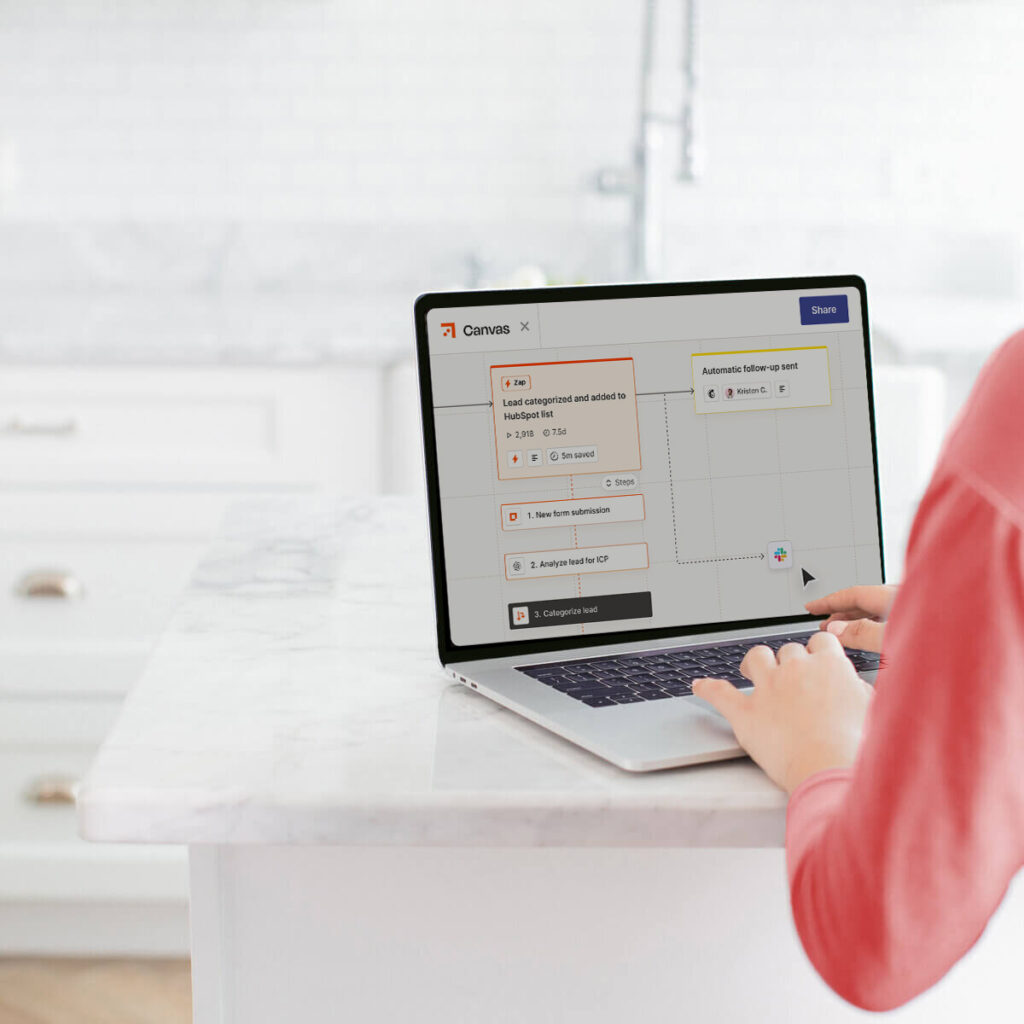 A woman entrepreneur connecting digital tools on a laptop—illustrating how technology simplifies and supports business growth.